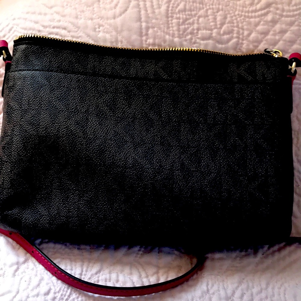 Brown purse with pink strap